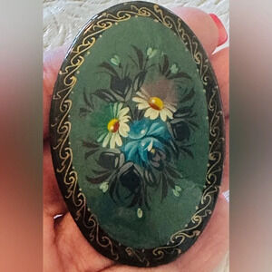 Vintage Russian black lacquer pin brooch with flower design.